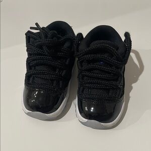 Jordan Black Sneakers with Glossy Finish and White Sole